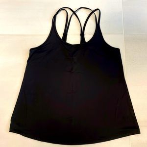 Excellent Condition. Wicking fabric, active tank with multi-strap detail